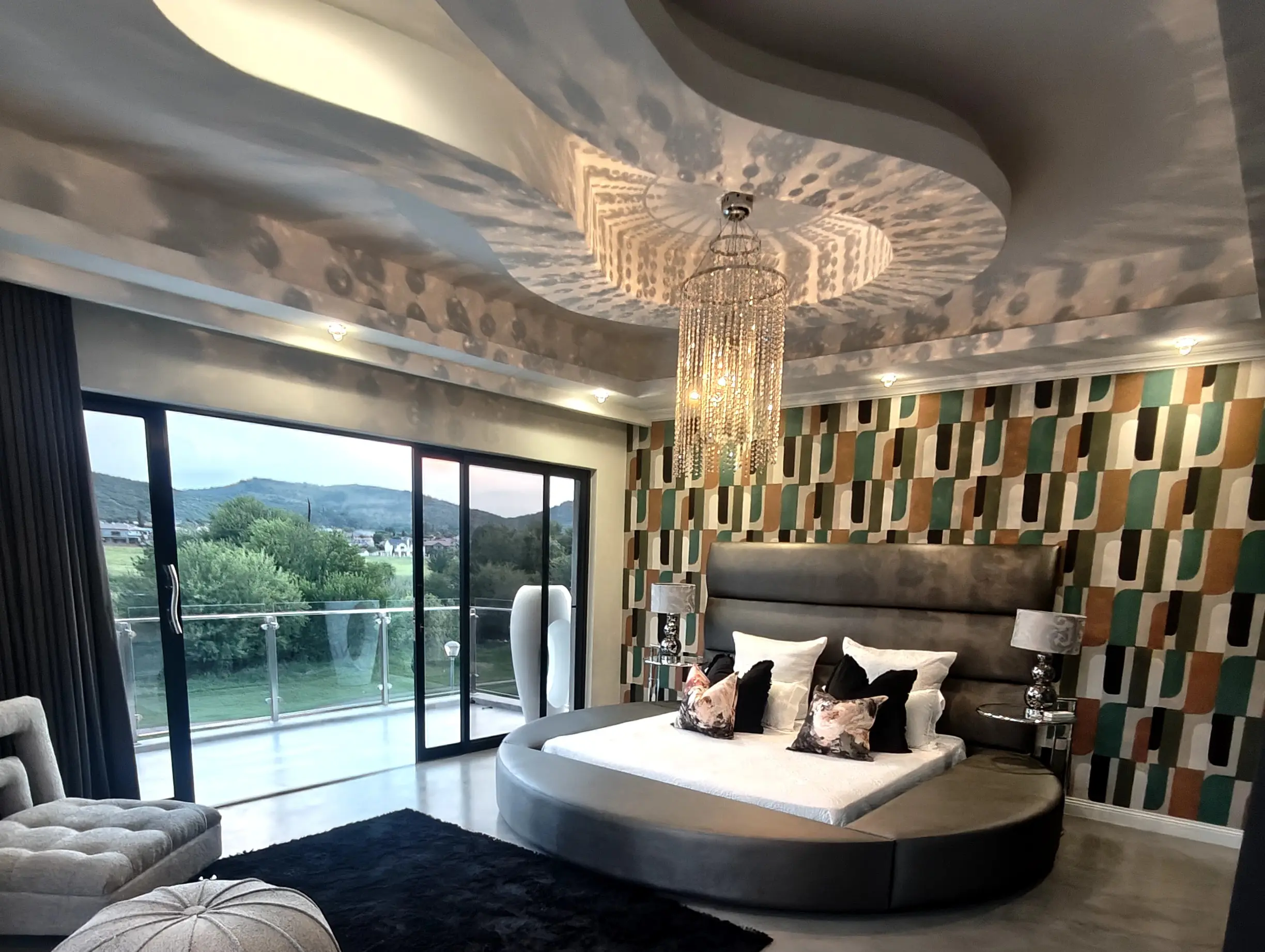 Cream wave pleat blockout curtains across a wall of glass in a main bedroom at Xanadu Nature Estate, Hartbeespoort